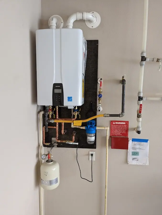 Professional plumber installing copper piping in a Indianapolis home